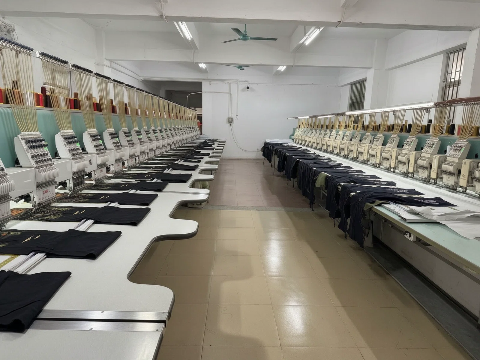 Row of multi-head embroidery machines stitching garments